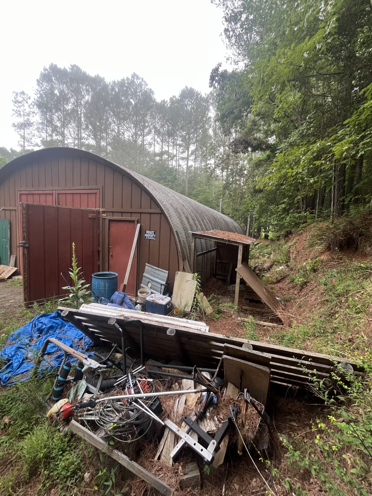 Pile of scrap metal, lumber and old bikes cleared from a property